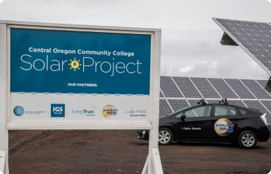 Redmond solar project with EV and arrays in background