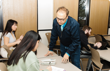 Instructor working with students in classroom