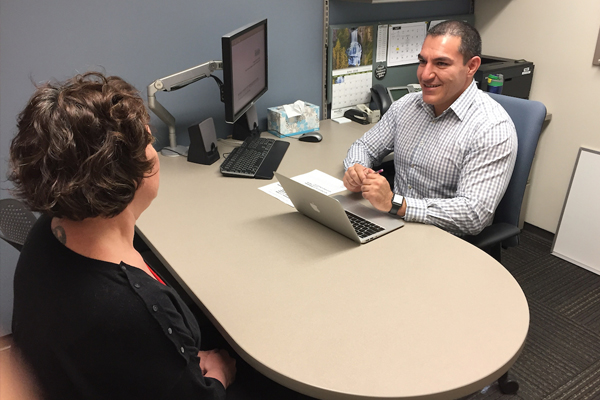 Small business advisor at COCC advising a student about small business management