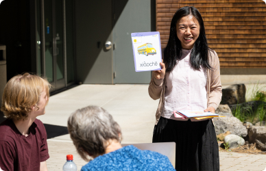 COCC faculty member using flash cards to teach language