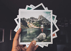 Photo of a hand holding photos