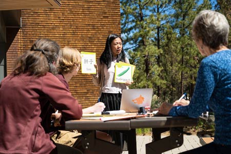 Central Oregon Community College Chinese language students and teacher learning flash cards