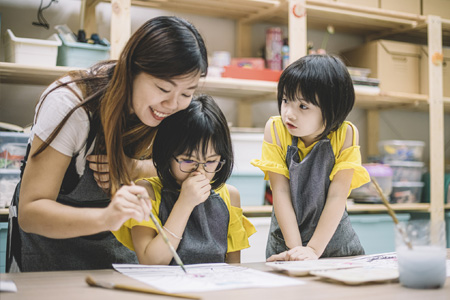 Community College student earning teaching certificate with hands on learning.