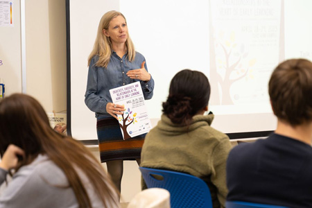 Education careers include Teaching, like this instructor in front of class giving a lesson plan