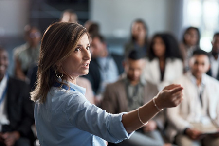 Woman practicing geograpy career in lecture environment